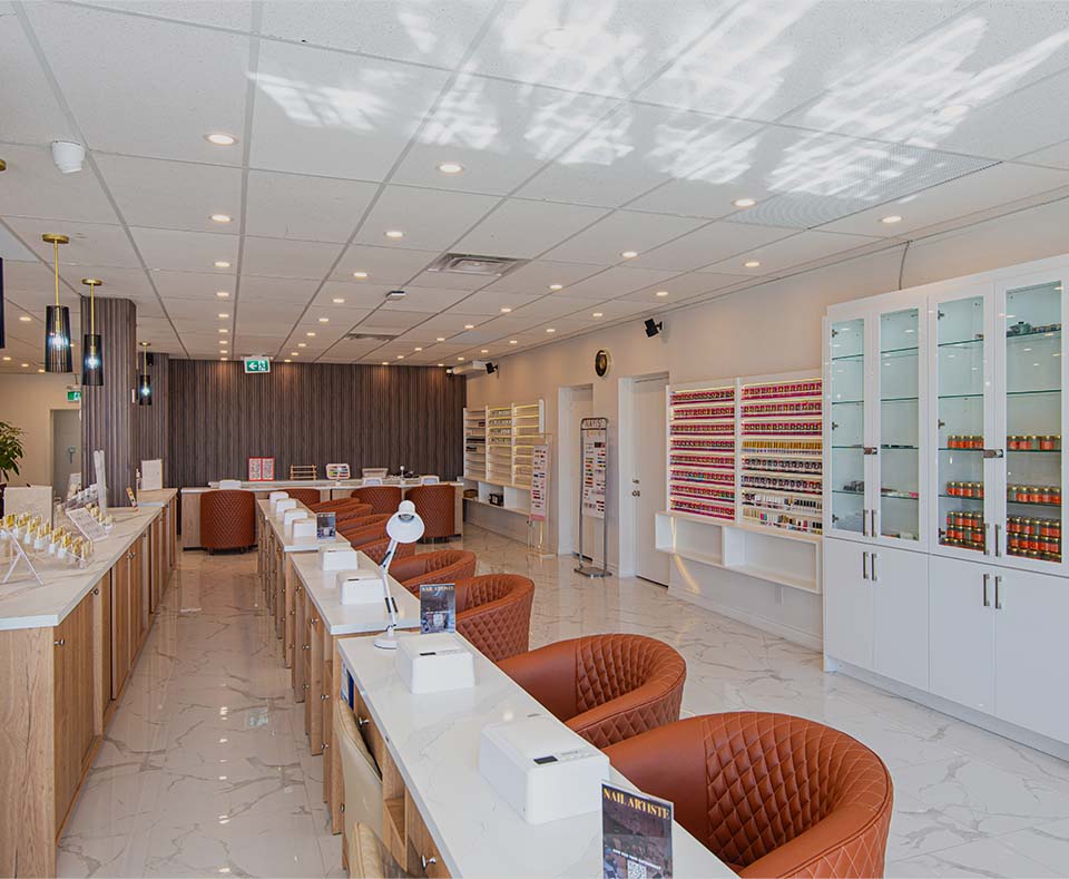 a room with a white counter and chairs